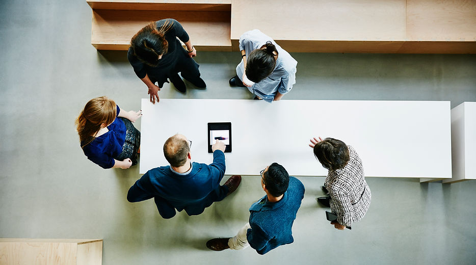 The HY Financial team working around a table
